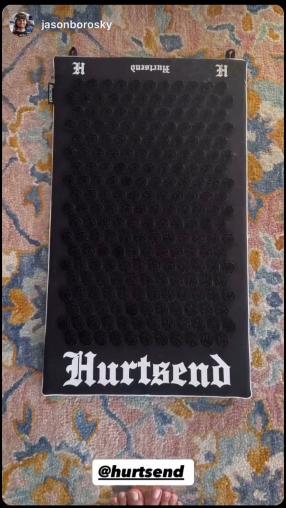 Black Hurtsend mat on a patterned surface